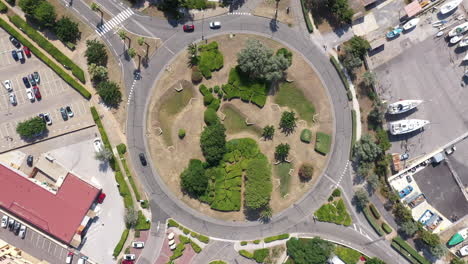 Roundabout-with-trees-and-few-cars-aerial-top-shot-Leucate-Occitanie-sunny-day